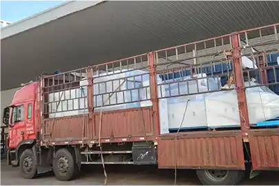 Truck transporting large wooden crate