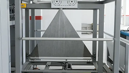 <p>Non-woven fabric cross-folding device with easy adjustment, which makes the bog mouth neat even without moving the whole machine.</p>
