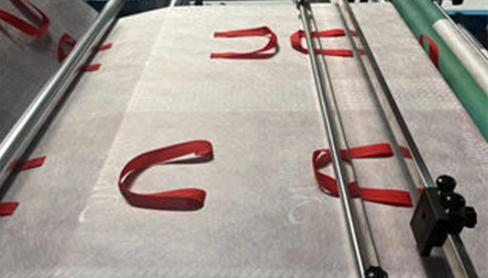 <p>Stepping motor and rubber roller for fabric feeding.</p>
