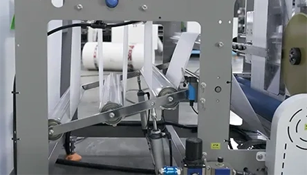 <p>Feeding and computer-controlled length adjustment by stepping motor, photocell eye tracking, bottom and side gusset making, and ultrasonic side sealing of the T-shirt bag.</p>
